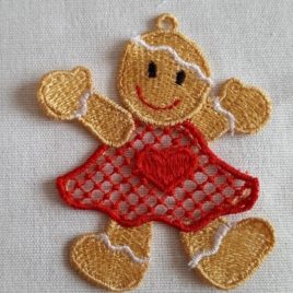 Broderie dentelle FSL, petit bonhomme pain d'épice en robe rouge