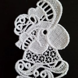 FSL, Broderie machine en dentelle couleur blanche représentant le Père Noël
