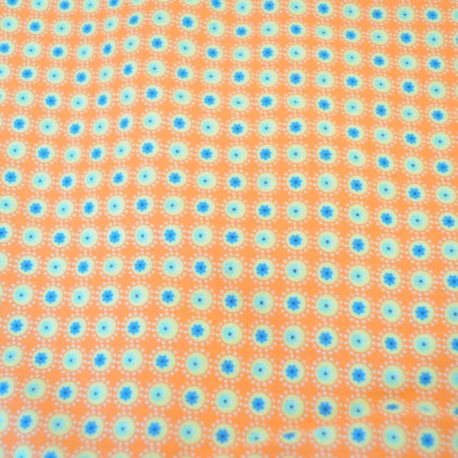 Tissu coton à fond orange surmonté de petits ronds jaunes et bleus