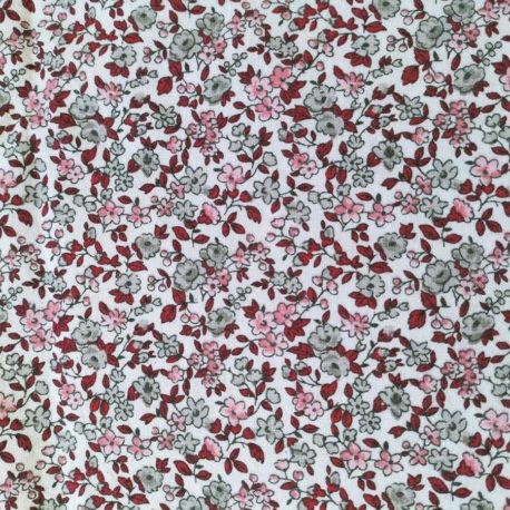Tissu certifié oeko-tex représentant des fleurs de couleur rose et grise sur fond blanc